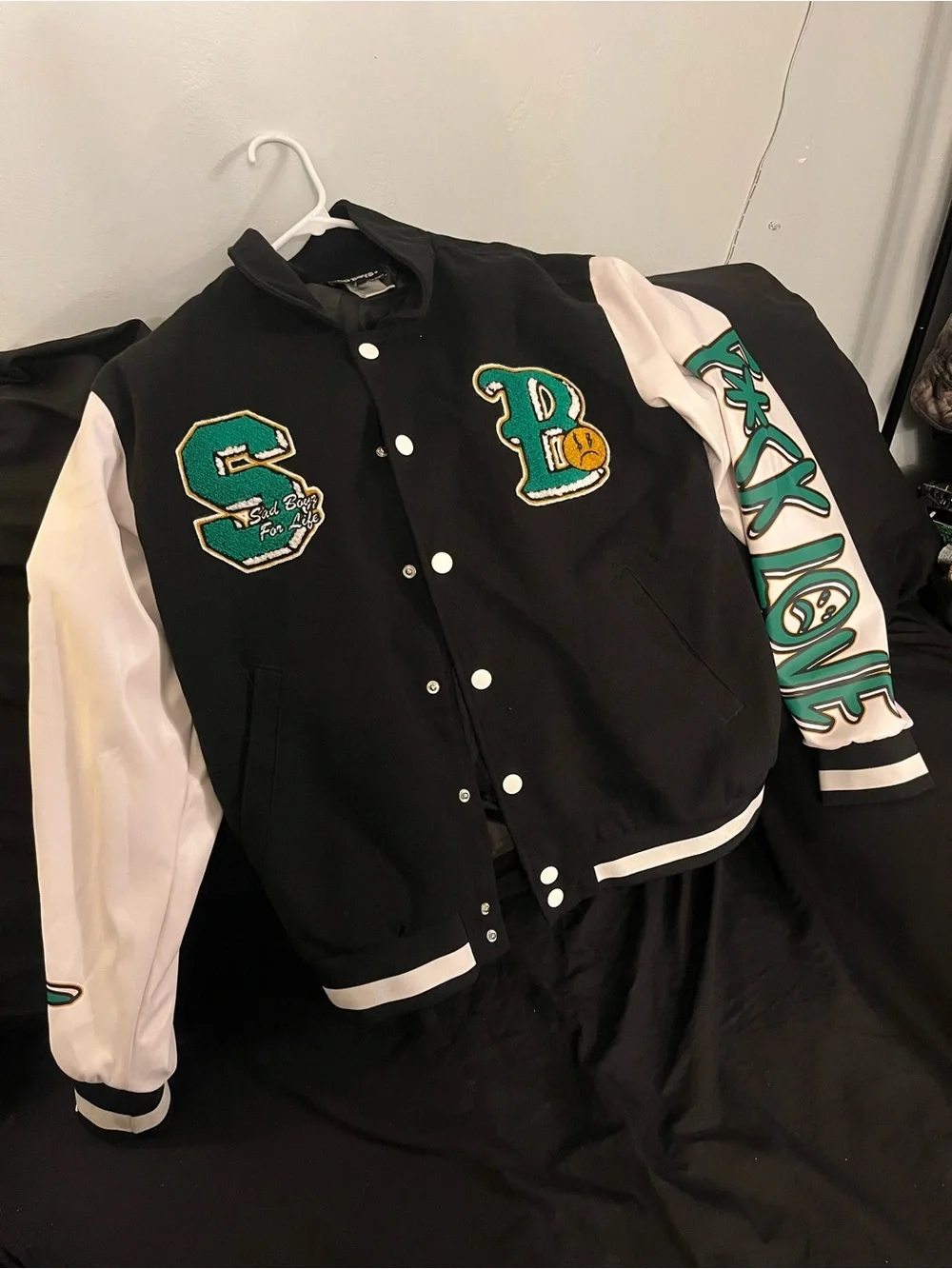 Black and White Letterman Jacket with Green Patch Accents